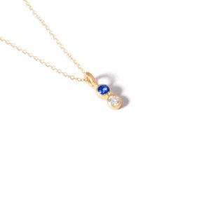 Gold necklace with two blue gems g