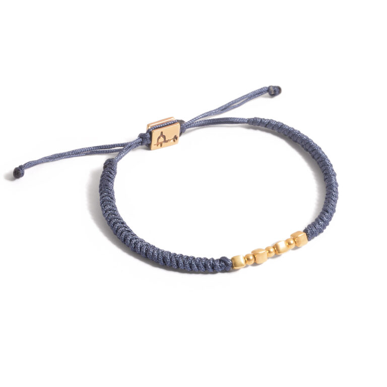 Gold bracelet with sphere and cube texture g