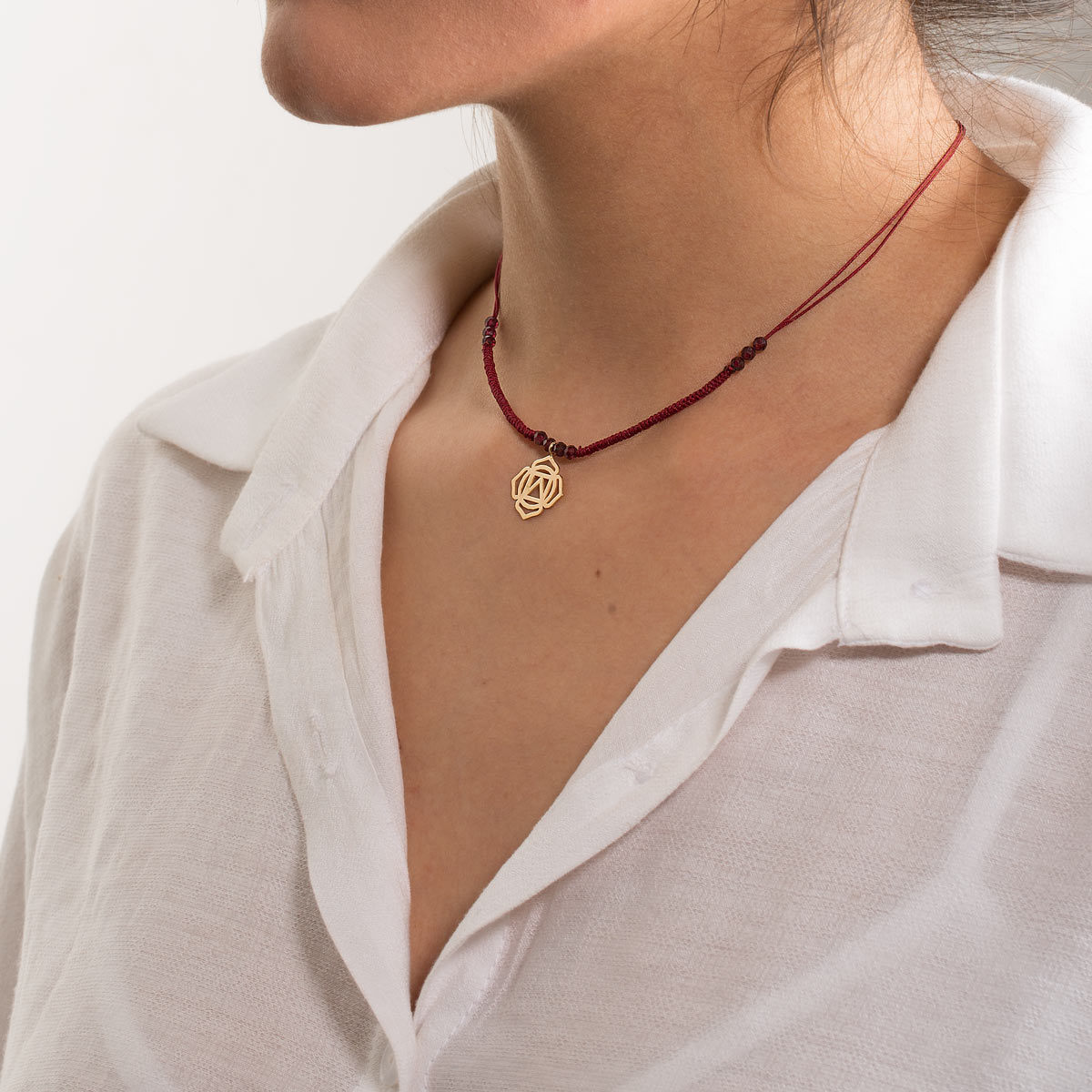 Root chakra woven gold necklace in