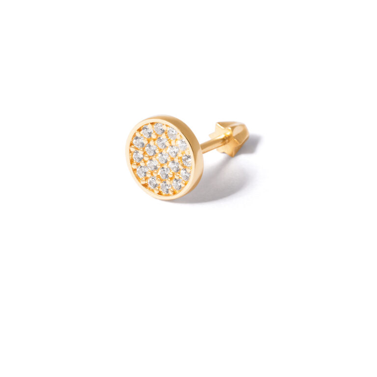 Gold piercing with jeweled circle g