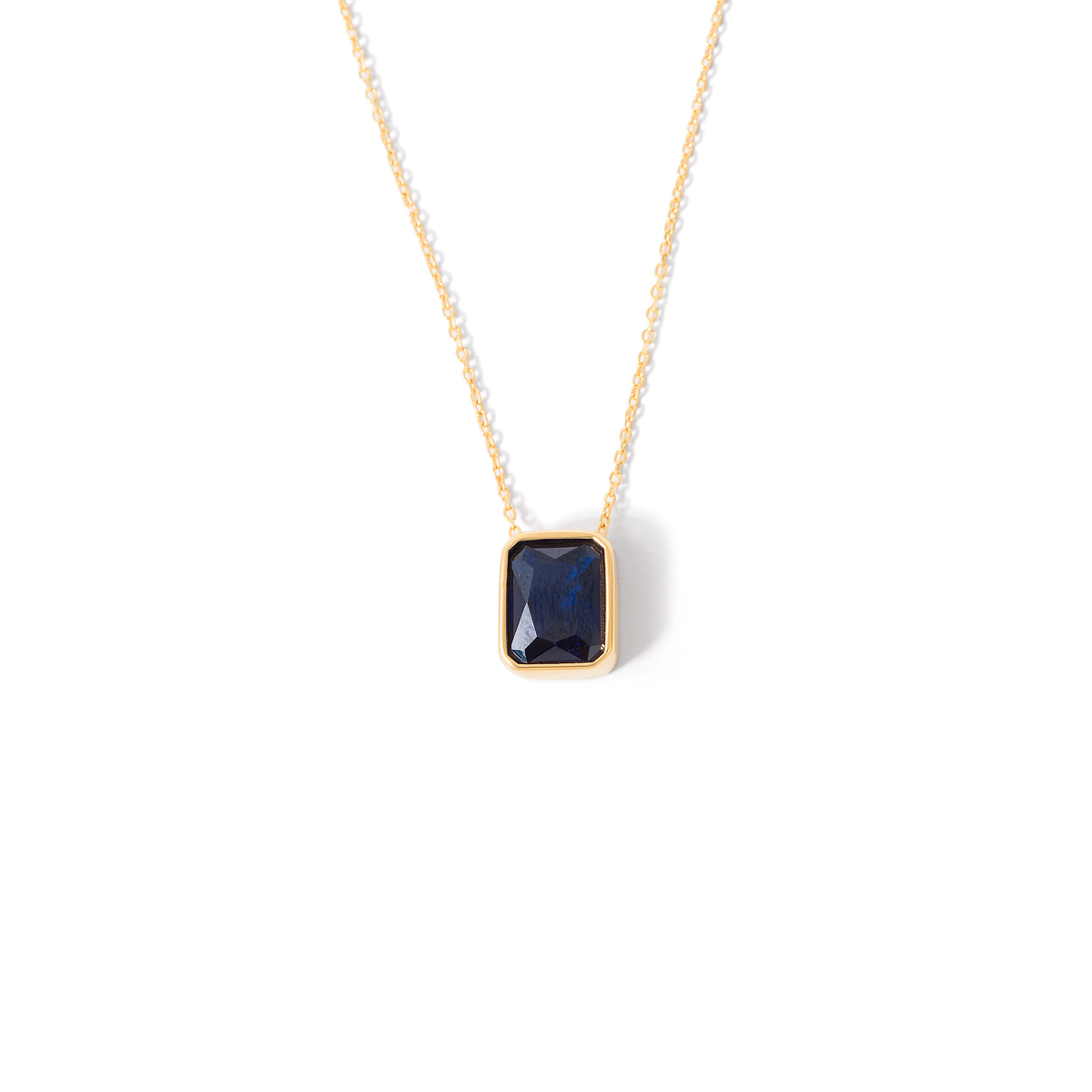 Gold necklace with a single gem g