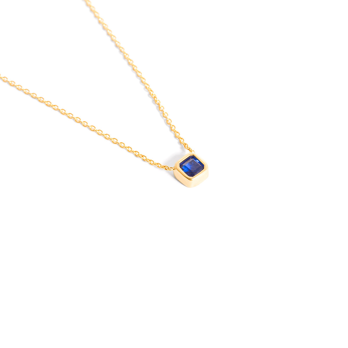 Gold necklace with a single gem g