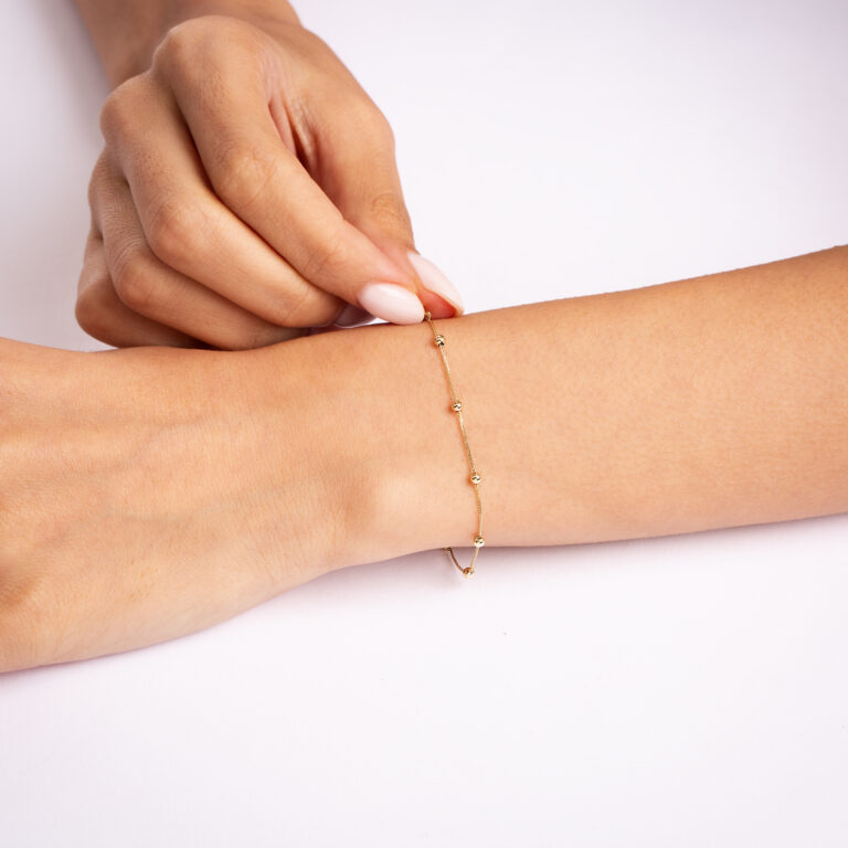 دستبند طلا زنجیری نه گوی گالری پرسته